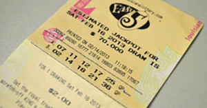 Close up of a printed Easy 5 ticket on a plain surface